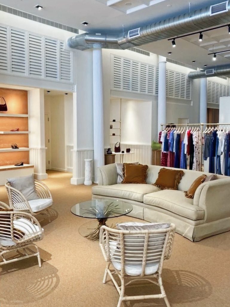 Main floor toward accessory alcoves: louvered transoms, warm